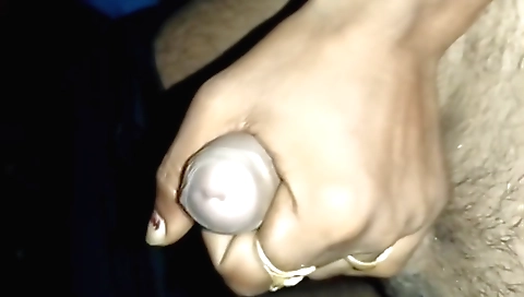 Man and his girlfriend make a handjob in the bedroom