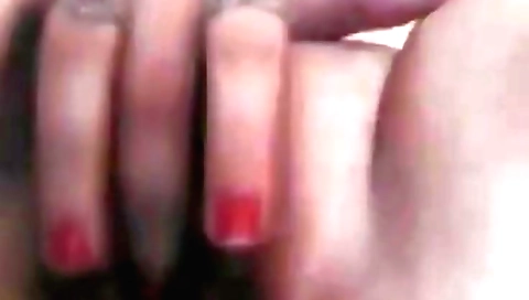 Amateur brunette fingering her tight pussy in a solo video