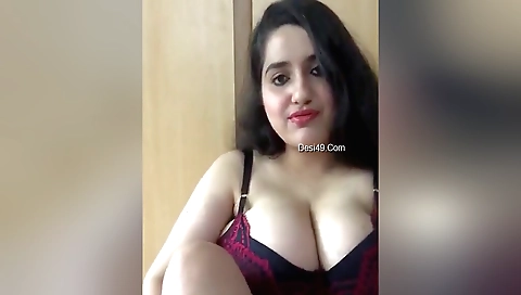 Indian brunette girl shows off her big boobs in front of camera