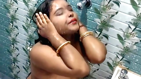 A sexy brunette mature wife bathes naked in the shower