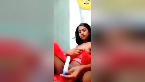 Brunette girl with a cute face finger herself with a plastic dildo
