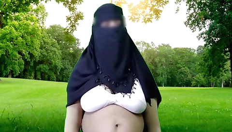 Indian face of housewife is showing off on a camera