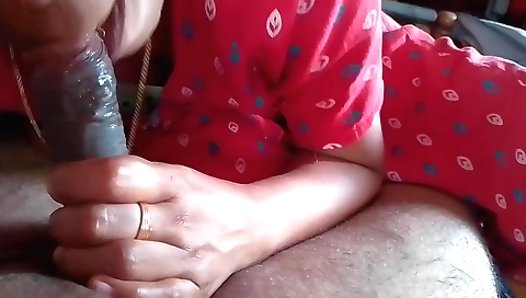Indian brunette sucking and massaging her man's deepthroat