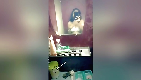 Sexy indian brunette wearing a pink dress on webcam