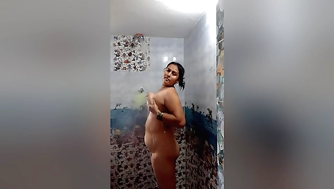 Amateur redhead enjoys shower and masturbates in bed