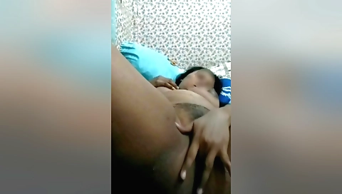 Busty brunette with a hairy pussy masturbates in solo