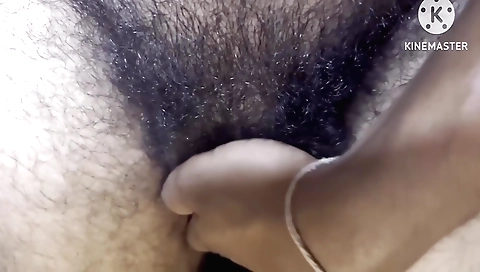 Sexy Indian girl with a hairy pussy is playing with it