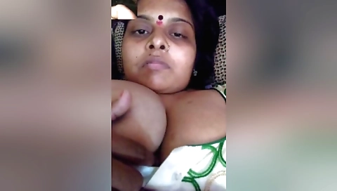 Bhabhi shows off her big breasts and ass on the camera