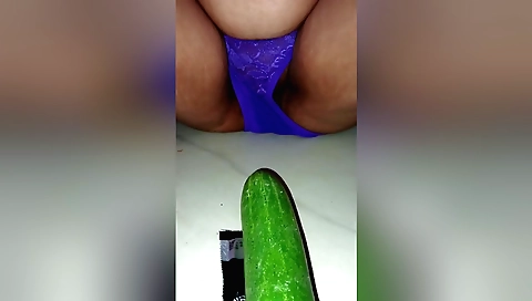 Solo female masturbates with a cucumber in amateur video