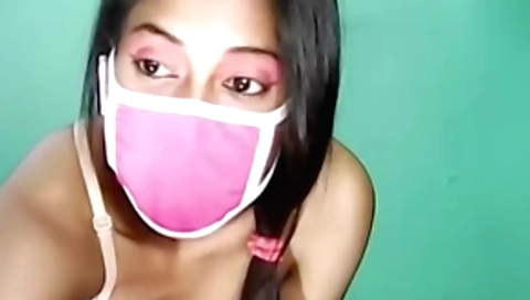 Indian girl in a red dress is making a homemade video