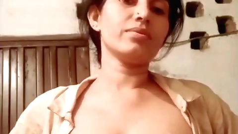 Sexy brunette with tanned body shows off her natural tits