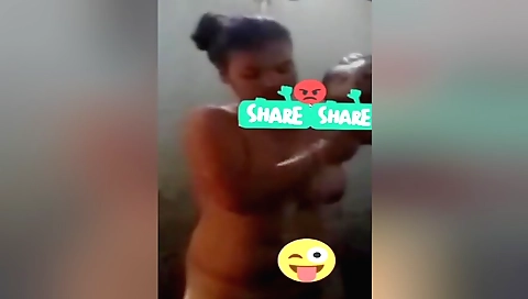 Sexy brunette in a bikini shows off her sexy big tits